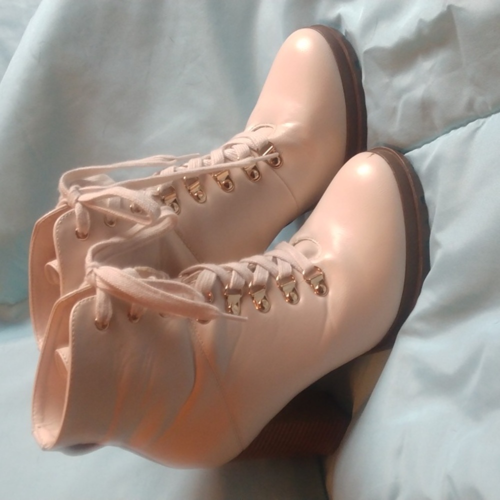 Ribonia cream colored lace up booties